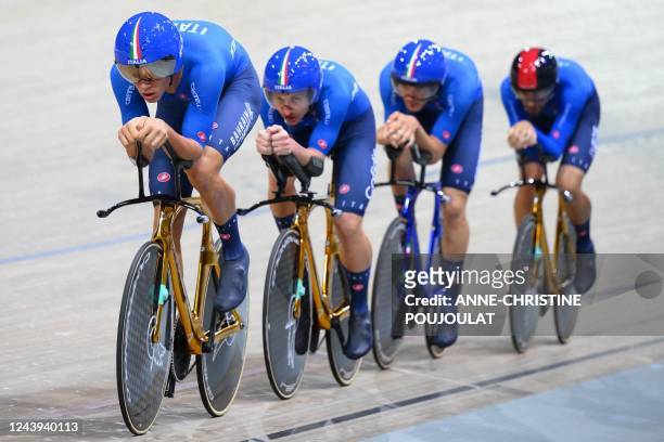 Italian team riders Simone Consonni, Filippo Ganna, Jonathan Milan and Manlio Moro compete in the Men's Team Pursuit finals during the UCI Track...