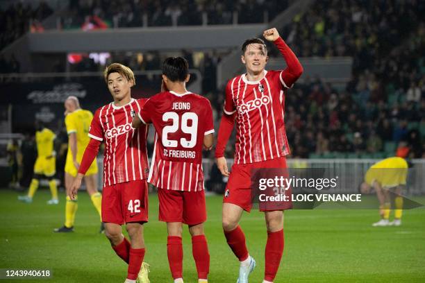 Freiburg's Michael Gregoritsch celebrates with team mates after scoring a goal during the UEFA Europa League group G football match between Nantes...