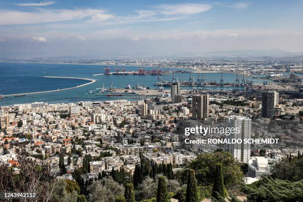 This picture taken on October 12, 2022 from atop Mount Carmel shows a view of the city and port of Haifa in northern Israel.