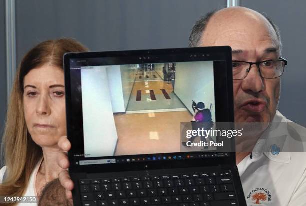 This was the last thing my son saw," says Michael Schulman as he holds a sreen shot of the Parkland shooting as his wife Linda Beigel Schulman looks...