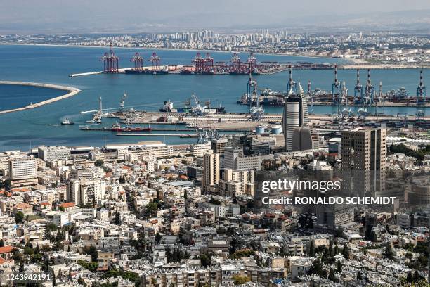 This picture taken on October 12, 2022 from atop Mount Carmel shows a view of the city and port of Haifa in northern Israel.