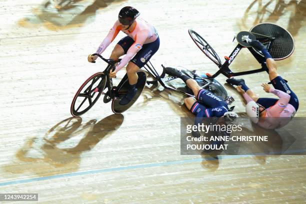 Netherlands' Jeffrey Hoogland and France's Sebastien Vigier crash as they compete in the Men's Keirin finals during the UCI Track Cycling World...
