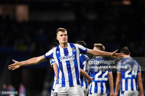 Real Sociedad's Norwegian forward Alexander Sorloth celebrates with teammates after scoring his team's first goal during the UEFA Europa League,...