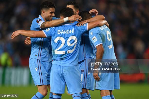 Trabzonspor's players celebrate after unseen Monaco French defender Malang Sarr scored an own goal during the UEFA Europa League first round day 4...