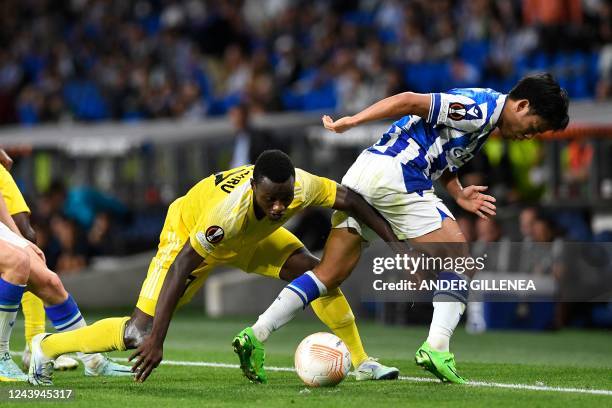 Sheriff's Ghana's midfielder Mudasiru Salifu vies with Real Sociedad's Japanese forward Takefusa Kubo during the UEFA Europa League, first round,...