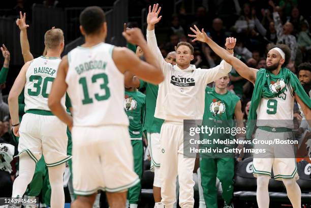 October 5: Blake Griffin of the Boston Celtics, center, celebrates during the first half of the NBA preseason game against the Toronto Raptors at the...