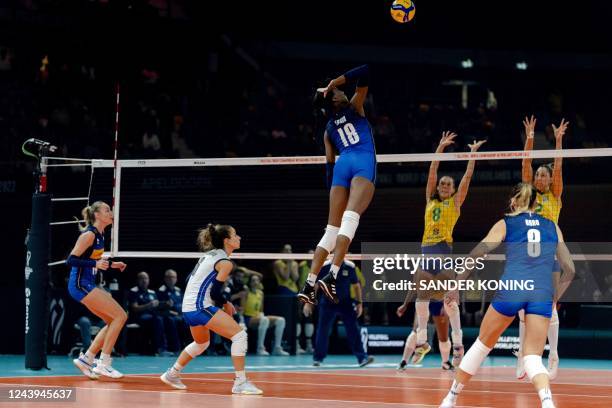Paola Ogechi Egonu spikes the ball during the volleyball Women's World Championship semi-final match between Brazil and Italy at the Omnisport in...