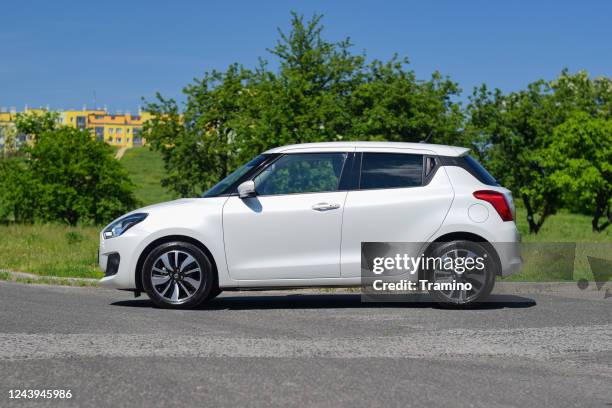 suzuki swift on a street - car side by side stock pictures, royalty-free photos & images