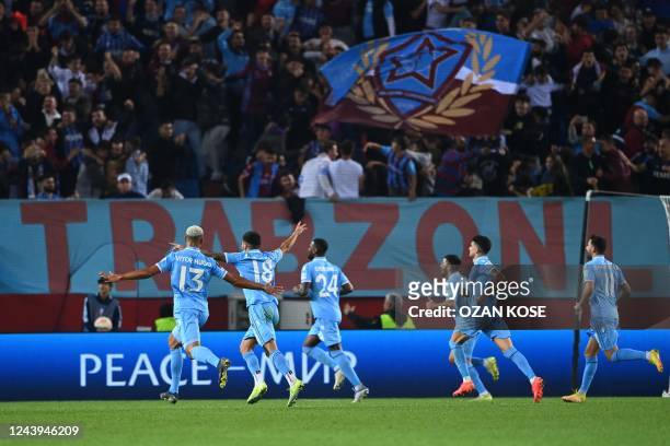 Trabzonspor's players celebrate scoring team's third goal during the Europa League Group H football match between Trabzonspor and AS Monaco at The...