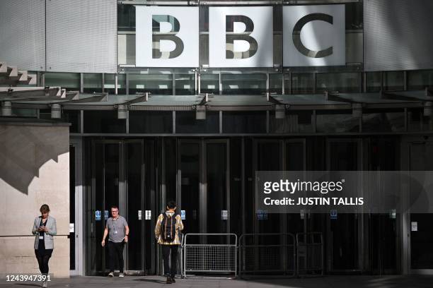 Pedestrians walk past the BBC Headquarters at the Broadcasting House in central London on October 6, 2022. - On November 14 the clipped tones of the...