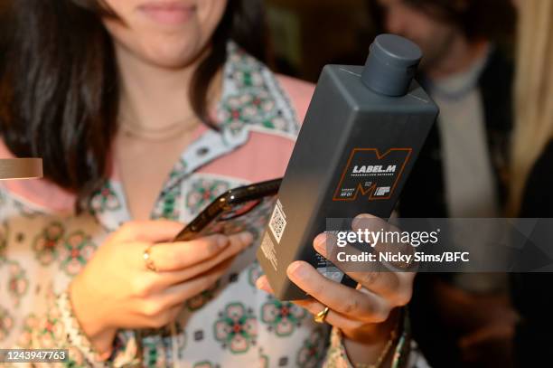 Guests explore scanning the QR codes on the products at the TONI&GUY LabelM product launch at Pavilion in Knightsbridge on October 13, 2022 in...