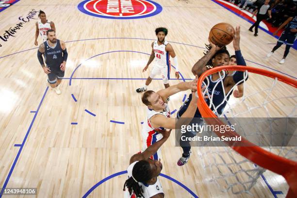 Ja Morant of the Memphis Grizzlies drives to the basket during the game against the Detroit Pistons on October 13, 2022 at Little Caesars Arena in...
