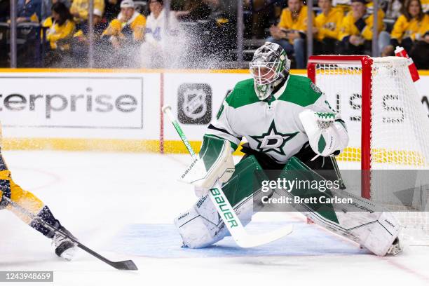 Jake Oettinger of the Dallas Stars is sprayed with snow by a Nashville Predators player during the first period at Bridgestone Arena on October 13,...