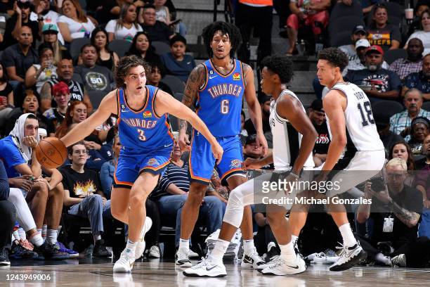 Josh Giddey of the Oklahoma City Thunder dribbles the ball against the San Antonio Spurs during a preseason game on October 13, 2022 at the AT&T...