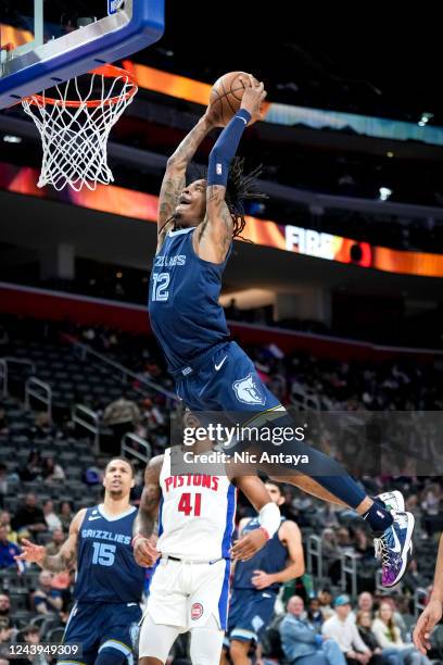 Ja Morant of the Memphis Grizzlies dunks the ball against the Detroit Pistons during the third quarter at Little Caesars Arena on October 13, 2022 in...