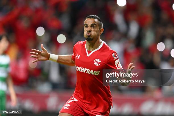 Camilo Sanvezzo of Toluca celebrates after scoring his team's third goal during the quarterfinals first leg match between Toluca and Santos Laguna as...