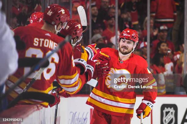 Rasmus Andersson of the Calgary Flames celebrates after scoring against the Colorado Avalanche during an NHL game at Scotiabank Saddledome on October...