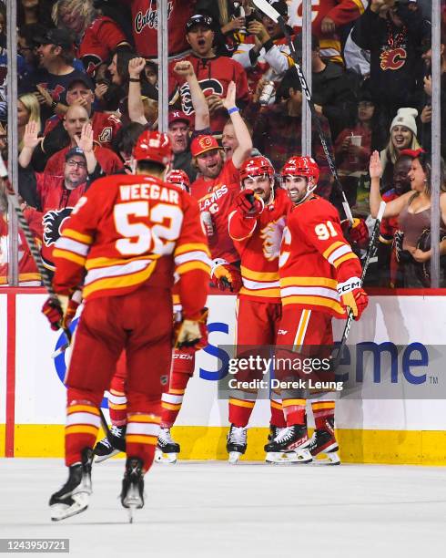 Rasmus Andersson of the Calgary Flames celebrates after scoring against the Colorado Avalanche during an NHL game at Scotiabank Saddledome on October...