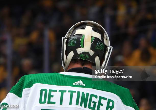 The artwork on the backplate of the mask of Dallas Stars goalie Jake Oettinger is shown during the NHL game between the Nashville Predators and...