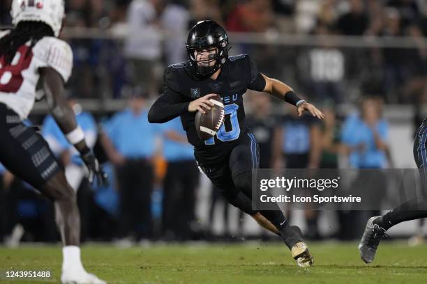 Knights quarterback John Rhys Plumlee decides to run after failing to find an open receiver during the game between the Temple Owls and the...