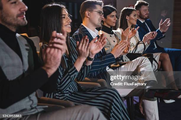 satisfied corporation owners in awe during a presentation - awards ceremony table stock pictures, royalty-free photos & images