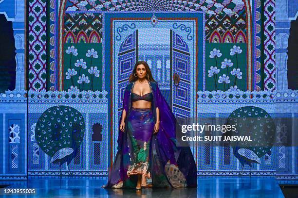 Bollywood actress Malaika Arora presents a creation by designer Limerick during the FDCI X Lakme Fashion Week in Mumbai on October 14, 2022. - --...