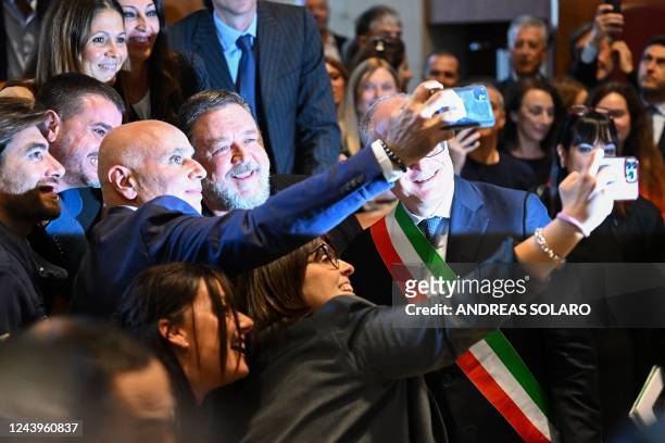 New Zealand actor Russell Crowe poses for selfies at Rome's City Hall on October 14, 2022 during a ceremony of career achievement honorary award by...