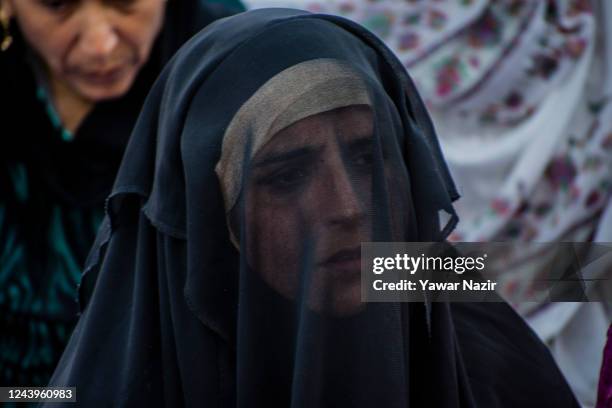 Kashmiri Muslim woman devotee prays, at Hazratbal shrine on the Friday following Eid-e-Milad , or the birth anniversary of Prophet Mohammad on...