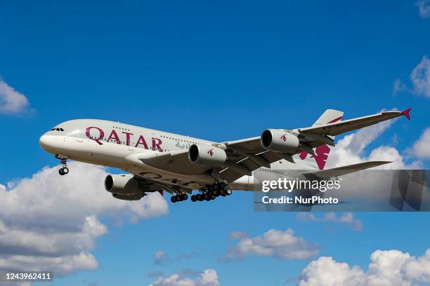 Qatar Airways Airbus A380 aircraft as seen on final approach flying over Myrtle Avenue the famous plane spotting location, for landing at London...