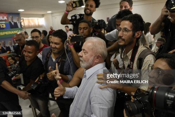 Brazil's former president and presidential candidate for the leftist Workers Party , Luiz Inacio Lula da Silva, poses for a picture with...
