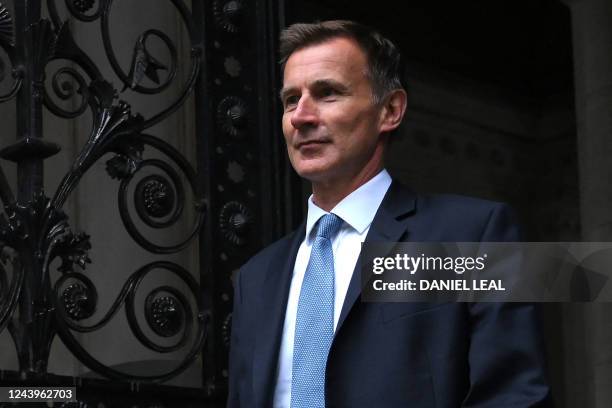 Britain's new Chancellor of the Exchequer Jeremy Hunt arrives in Downing Street in central London on October 14, 2022. - Newly appointed UK finance...