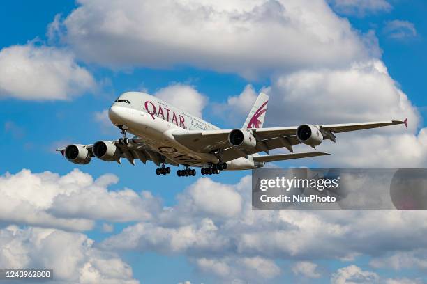 Qatar Airways Airbus A380 aircraft as seen on final approach flying over Myrtle Avenue the famous plane spotting location, for landing at London...