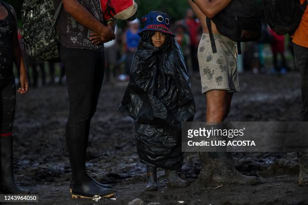 Venezuelan migrants wait to be registered at Canaan Membrillo village, the first border control of the Darien Province in Panama, on October 13,...