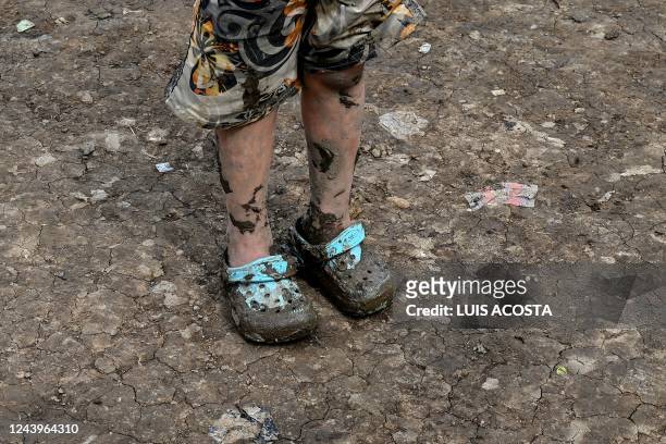 Venezuelan migrant girl arrives at Canaan Membrillo village, tthe first border control of the Darien Province in Panama, on October 12, 2022. - The...