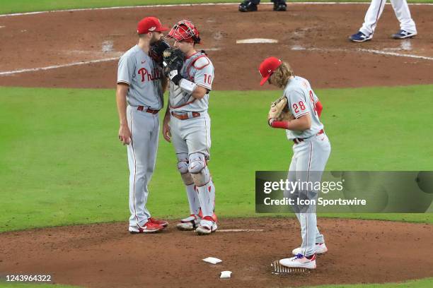 Philadelphia Phillies catcher J.T. Realmuto and Philadelphia Phillies starting pitcher Zack Wheeler confer at the pitchers mound during Game 2 of the...