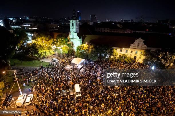 Participants gather during a protest in downtown Bratislava on October 14, 2022 two days after a 'radicalised teenager' shot dead two men at the...