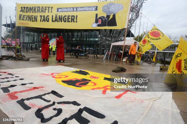 Two activists from the extinction Rebellion are seen during the green party delegate conference at United Nation plaza in Bonn, Germany on Oct 14,...