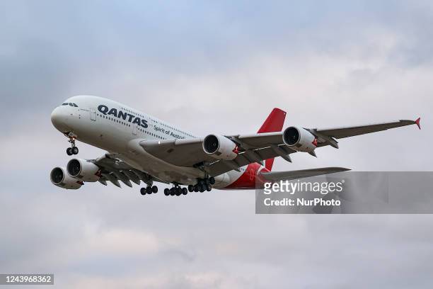 Qantas Airbus A380 aircraft as seen flying and landing at London Heathrow Airport LHR. The wide body double-decker Airbus A380 aircraft has the...