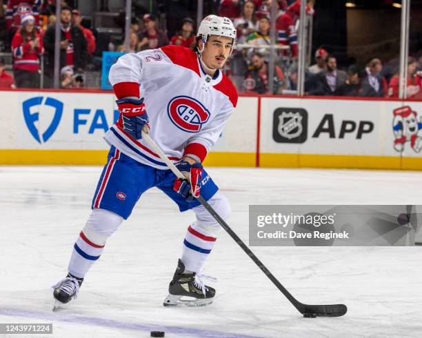 Arber Xhekaj of the Montreal Canadiens handles the puck during pre-game warm-ups before an NHL game against the Detroit Red Wings at Little Caesars...