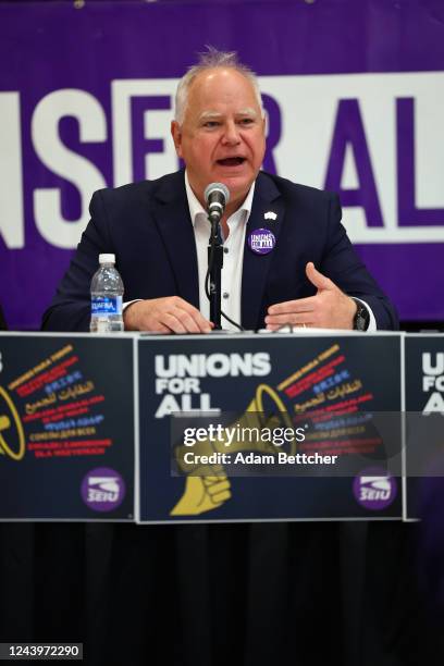Minnesota Governor Tim Walz speaks with union organizers before they march on businesses in downtown Minneapolis on October 14, 2022 in Minneapolis,...