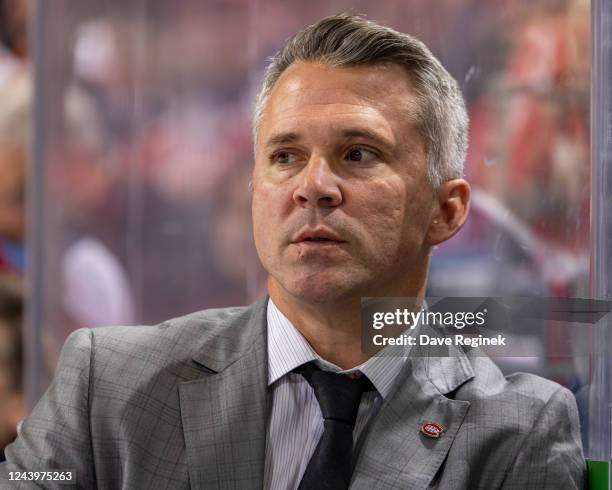 Head coach Martin St-Louis of the Montreal Canadiens watches the action from the bench during the first period an NHL game against the Detroit Red...