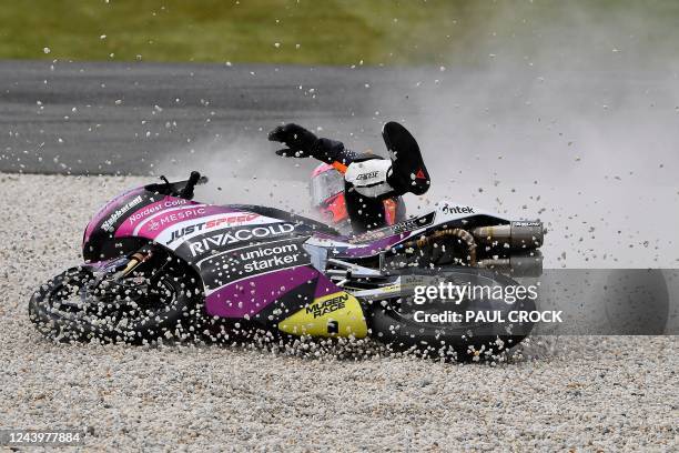 Rivacold Snipers' Italian rider Andrea Migno falls from his bike during the Moto3 qualifying session in Phillip Island on October 15 ahead of...