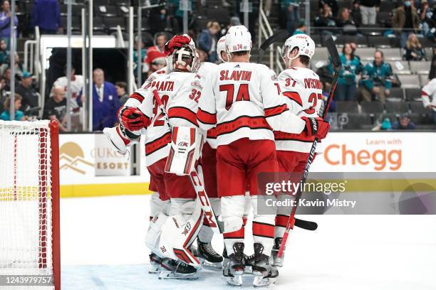 The Carolina Hurricanes celebrate the win against the San Jose Sharks at SAP Center on October 14, 2022 in San Jose, California.