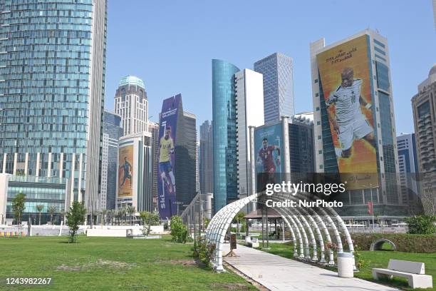 The likeness of Neymar, Andre Ayew and Duan Tadi on 2022 FIFA World Cup posters covering West Bay skyscrapers in Doha, Qatar on 15 October 2022.