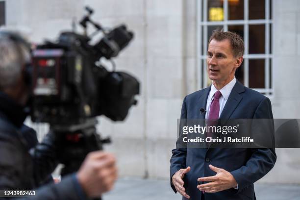 Chancellor of the Exchequer, Jeremy Hunt, takes part in a TV interview outside BBC Broadcasting House on October 15, 2022 in London, England. Former...