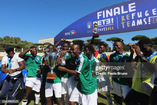 The players of Partinico team celebrate the victory of the FIGC 'Progetto Rete- Refugee Team' tournament at Foro Italico on October 15, 2022 in Rome,...