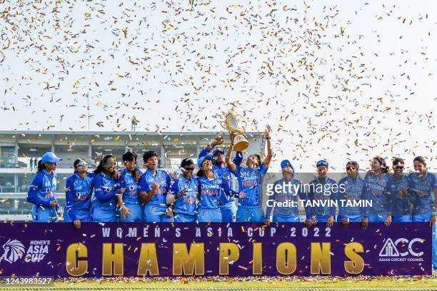 Indias cricketers celebrate their victory at the end of the women's Asia Cup final cricket match between India and Sri Lanka at Sylhet International...