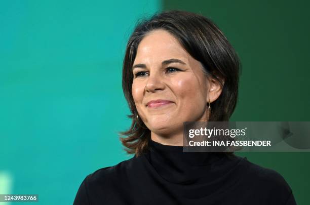 German Foreign Minister Annalena Baerbock smiles as she delivers a speech during the congress of the Green Party in Bonn, western Germany on October...