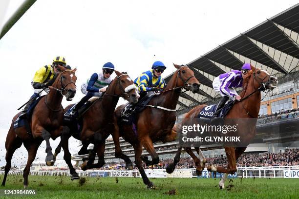 Eventual winner, jockey Hollie Doyle on Trueshan between horses on the first lap of the Long Distance Cup on Qipco British Champions Day at Ascot...