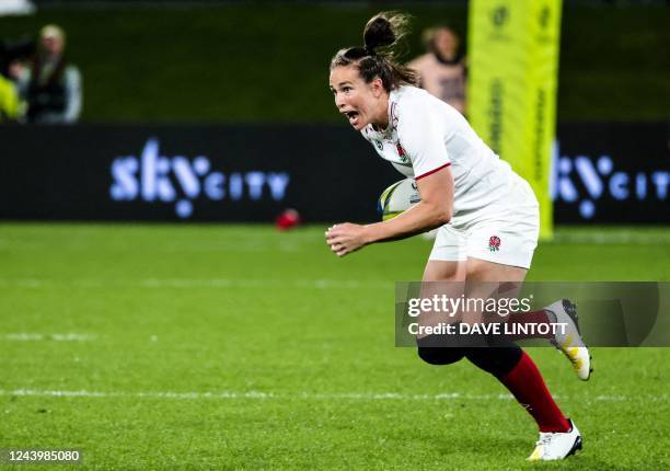 England's Emily Scarratt runs with the ball during the New Zealand 2021 Women's Rugby World Cup Pool C match between France and England at Northland...